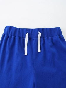 Royal blue kids cotton sports trousers with elastic waist and white drawstrings