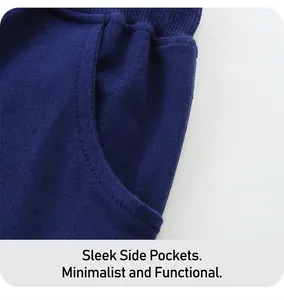 Detailed close-up of side pocket on navy knit boys' shorts with reinforced stitching