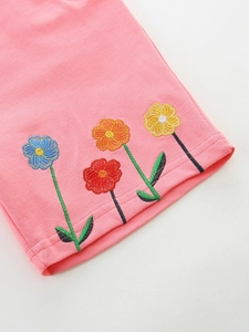 Pink knitted shorts for girls with detailed colorful flower embroidery on soft fabric