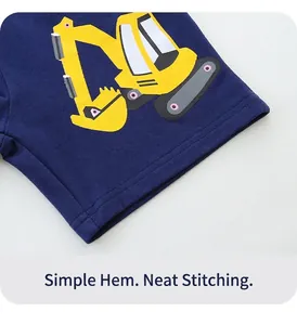 Close-up of navy blue cotton shorts with yellow excavator print and durable stitching