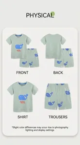 Detail view of boys' light green cotton set with whale prints and Ocean Vibes text