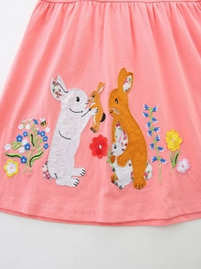 Pink cotton girls dress featuring detailed rabbit embroidery and floral patterns
