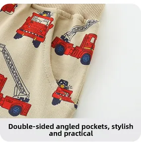 Detail of boys knit cotton shorts with car print and double slanted side pockets