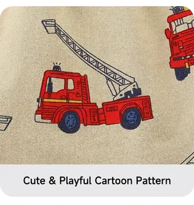 Close-up of beige cotton shorts featuring a vibrant red cartoon fire truck print