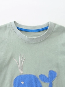 Light green cotton T-shirt for boys featuring blue whale applique and crew neck detail