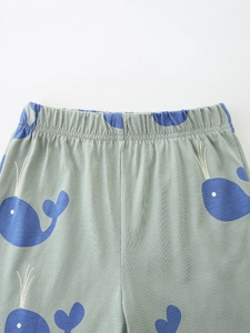Boys summer cotton set featuring cute blue whale print with elastic waistband detail