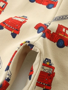 Kids' beige cotton knit shorts featuring vibrant red fire truck and blue crane prints
