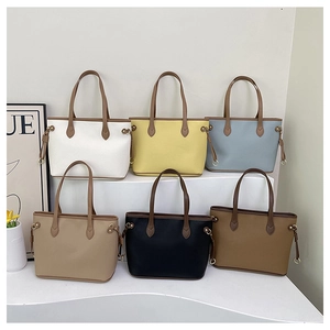 Collection of large leather tote bags in various colors for daily office commute