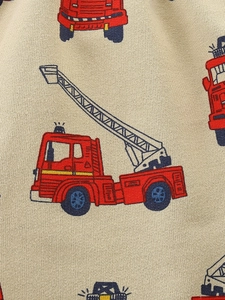 Boys' knit cotton shorts with cartoon fire truck print in beige fabric texture