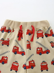 Boys cotton knit shorts with fire truck print and red drawstring in light brown