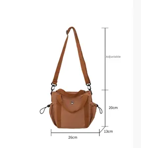 Brown nylon tote bag with dimensions 26x20x13cm and adjustable shoulder strap