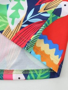 Girls' short sleeve dress featuring tropical parrot and leaf prints with refined stitching