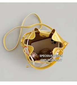 Top view showing the spacious interior and storage capacity of the yellow bucket bag