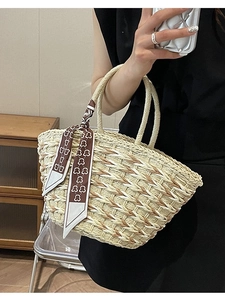 Handmade beige straw tote bag with brown bear scarf detail for casual summer outings