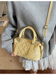 Lemon yellow quilted bucket bag with silver rhinestones and adjustable strap for women