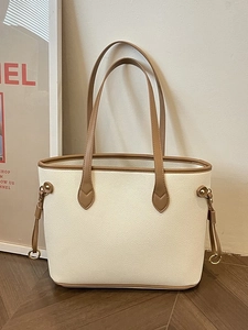 White lychee pattern leather tote bag with brown trim and gold hardware details