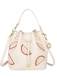 Chic cream-colored bucket bag featuring citrus fruit embroidery and golden hardware