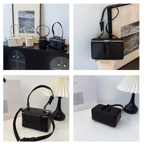 Detailed views of the mini box crossbody bag featuring textured leather and dual zippers