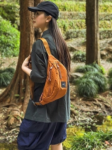 Orange nylon crossbody sling bag for outdoor hiking and casual sports activities