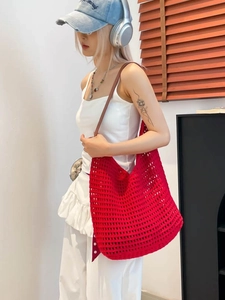 Large red hollow crochet tote bag with brown leather handles for summer beach vacations