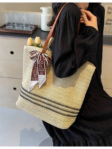 Minimalist beige straw tote bag with black stripes and animal print scarf handle