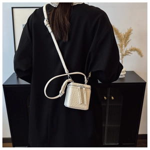 Mini off-white box bag with croc-embossed leather texture and thin shoulder strap