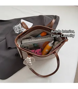 Detailed view of the spacious interior of a beige tote bag showing its storage capacity