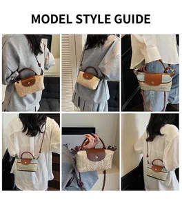 Detail of mini straw handbag with brown leather strap in natural and striped colors