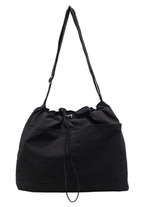 Minimalist black waffle texture drawstring tote bag with adjustable shoulder strap