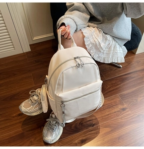 White faux leather backpack with litchi texture and jacquard woven shoulder straps