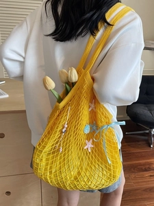 Large yellow mesh woven tote bag with starfish brooch and ribbon for women