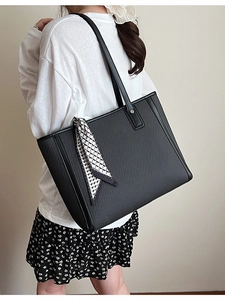 Large black textured tote bag for women featuring a stylish geometric print silk scarf