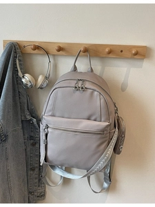 Chic light purple large capacity backpack with textured leather and woven strap