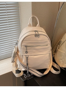 White lychee pattern leather backpack with arrow strap and coin purse accessory