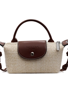 Mini hand-woven straw bag with cream knit body and brown leather flap for summer beach trips