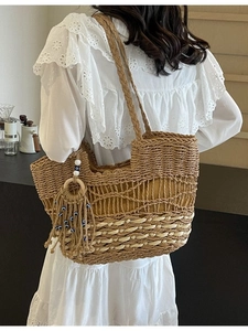 Bohemian hollow straw tote bag with evil eye tassel and large capacity design