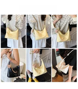 Three-color crocodile-textured hobo bags with metallic buckles and cute bear charms