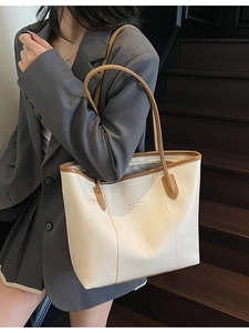 Retro cream white tote bag with brown trim and shoulder straps for daily commuting