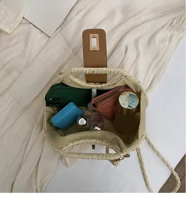 Macro view of woven straw bag interior showing spacious storage for daily essentials