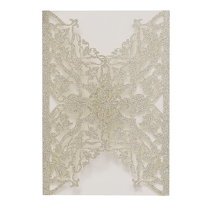 Macro shot of silver glitter laser-cut floral pattern for luxury wedding invitations
