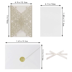 Detailed set of laser-cut glitter wedding invitations with envelope and white ribbon