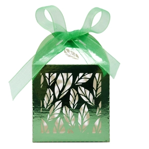 Detailed laser-cut leaf pattern on emerald green candy box with a matching silk ribbon bow