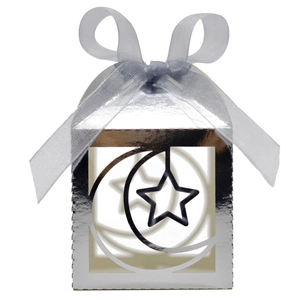 Close-up of silver hollowed star and moon candy box with elegant organza ribbon bow