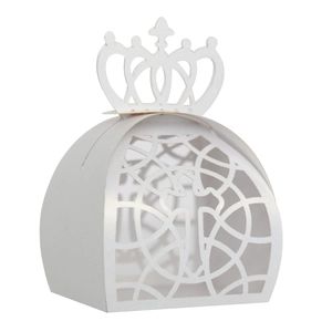 Detailed laser-cut white crown favor box with intricate hollow floral patterns