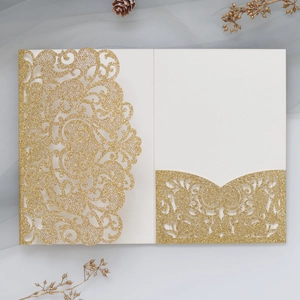 Elegant gold glitter laser cut lace wedding invitation card with intricate floral patterns