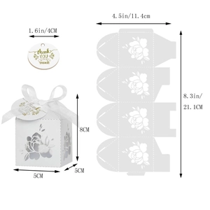 Laser-cut white wedding gift box with floral pattern, silk ribbon, and thank you tag