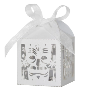 Detailed laser-cut Tiki mask and palm tree patterns on white pearl paper candy box
