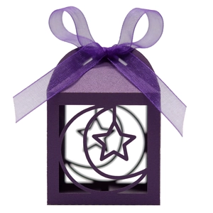 Detail of purple hollow paper candy box with moon star patterns and organza ribbon bow