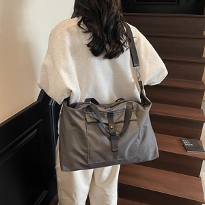 Large capacity grey nylon travel duffel bag with shoulder strap for sports or short trips