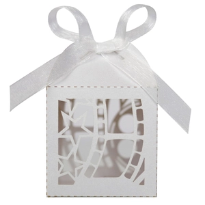 Detail of white laser-cut gift box with film roll pattern and satin ribbon bow